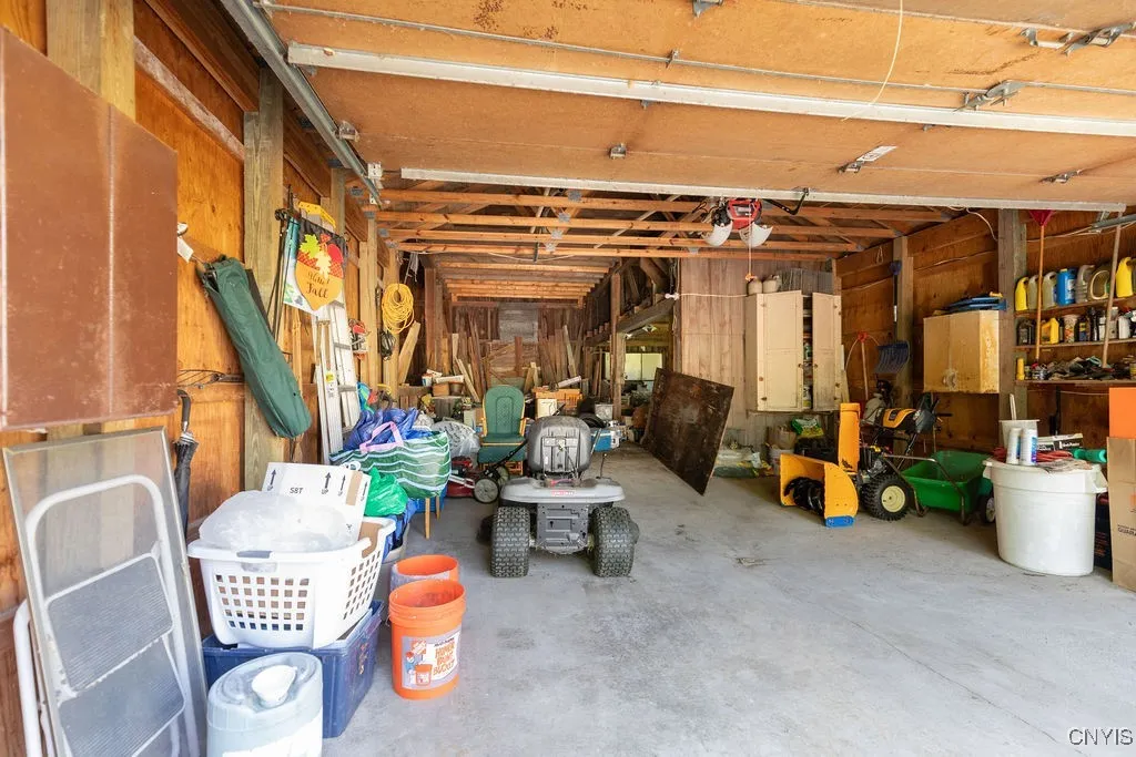 Spacious two car garage with attached three level barn