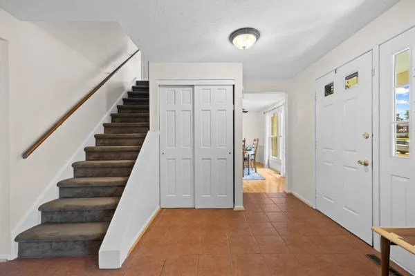 Entryway with Ceramic Tile Flooring and Closet