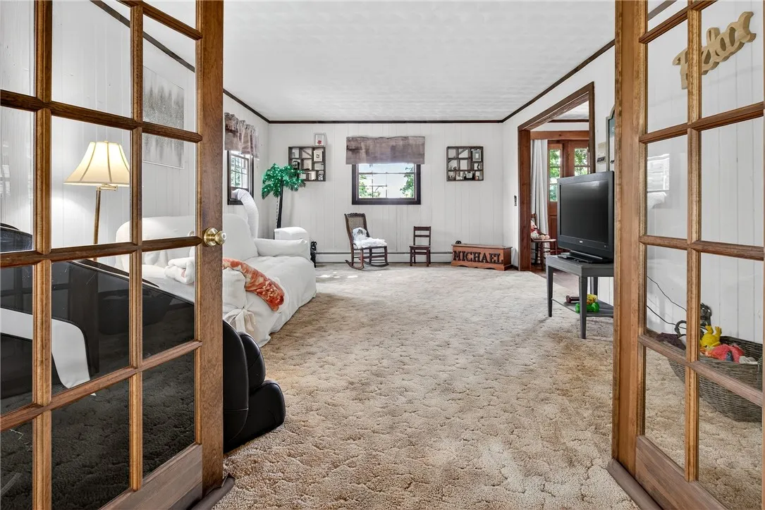 Beautiful French doors can separate the living room and the enclosed porch