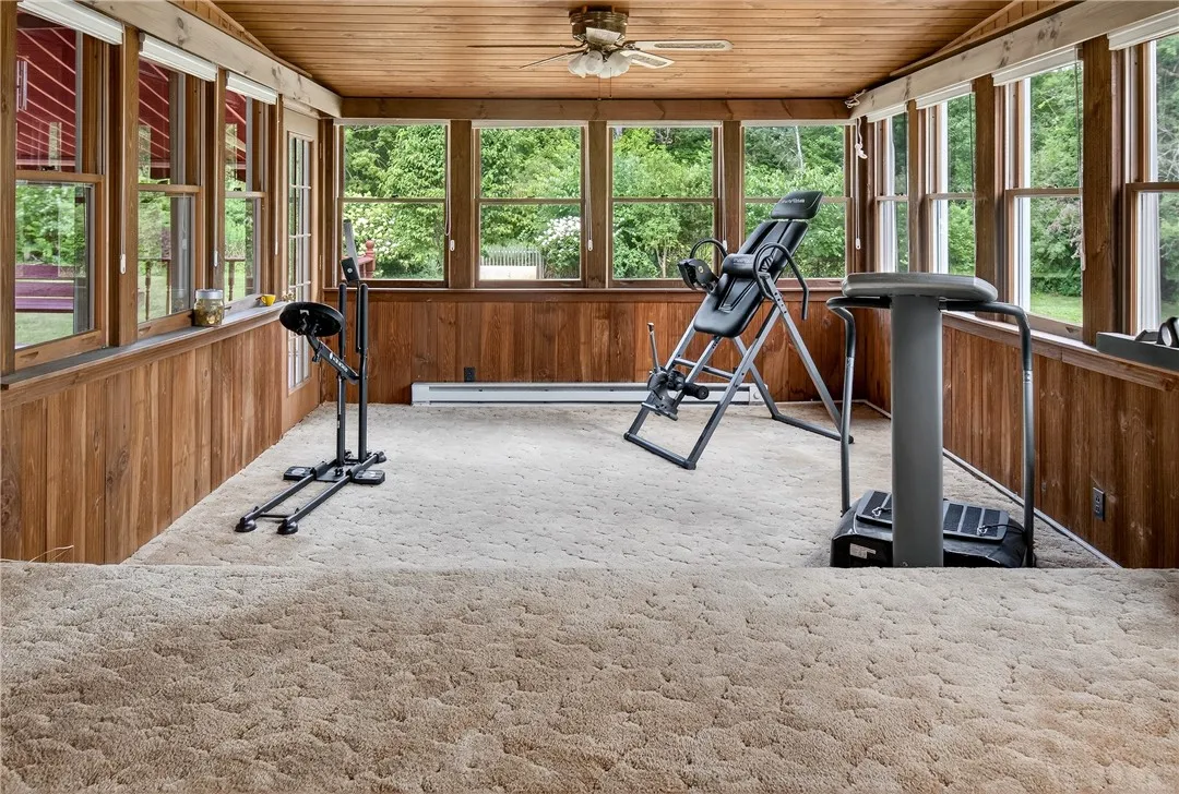 The enclosed heated porch lets in an abundance of light with panoramic views