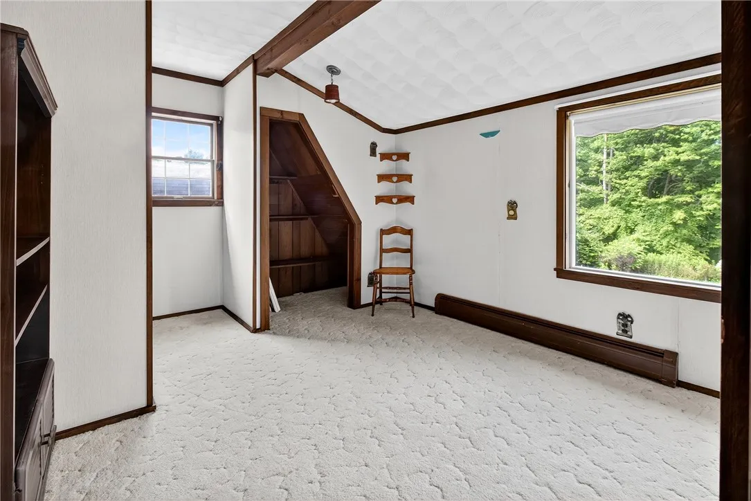 Second bedroom upstairs with a big window to let in an abundance of light