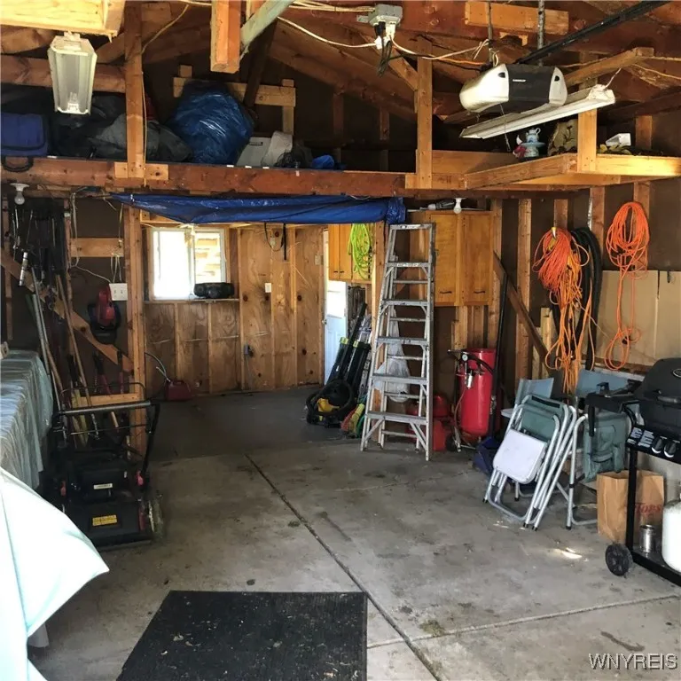 Garage has storage loft and attached Workshop