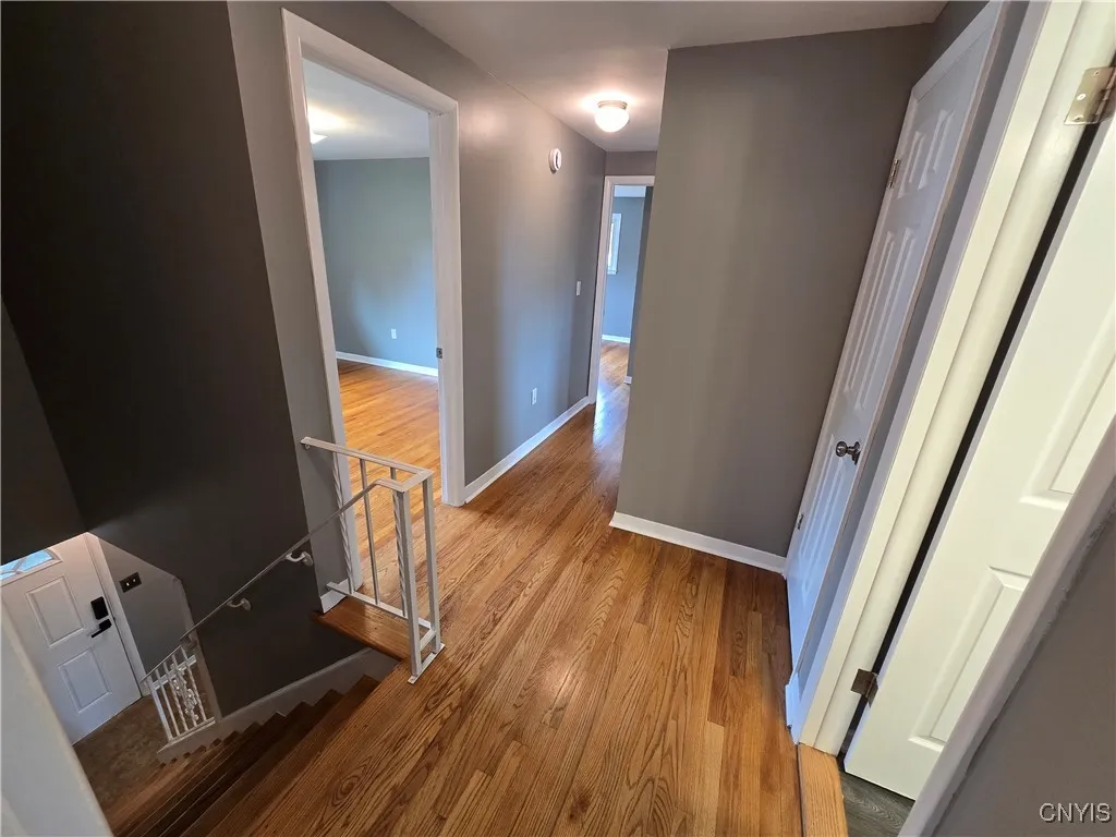 Second floor- stairs, bathroom, three additional bedrooms