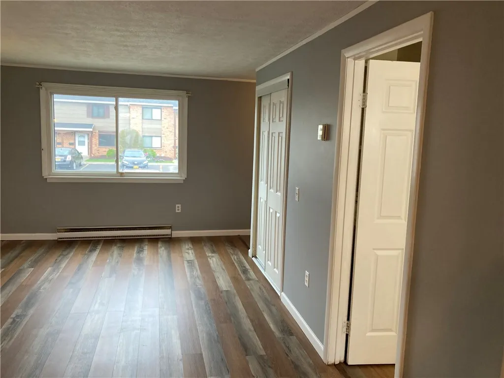 
Other view of great room, showing guest closet and half bath entrance.