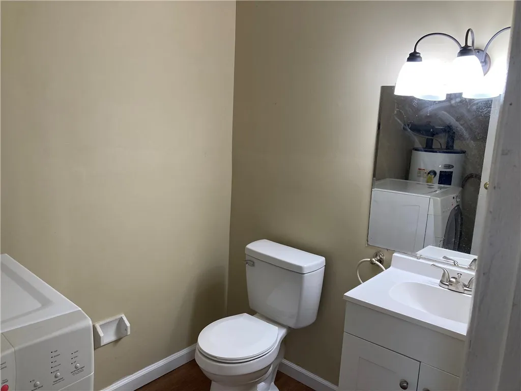 
First floor powder room with new vanity and new commode.