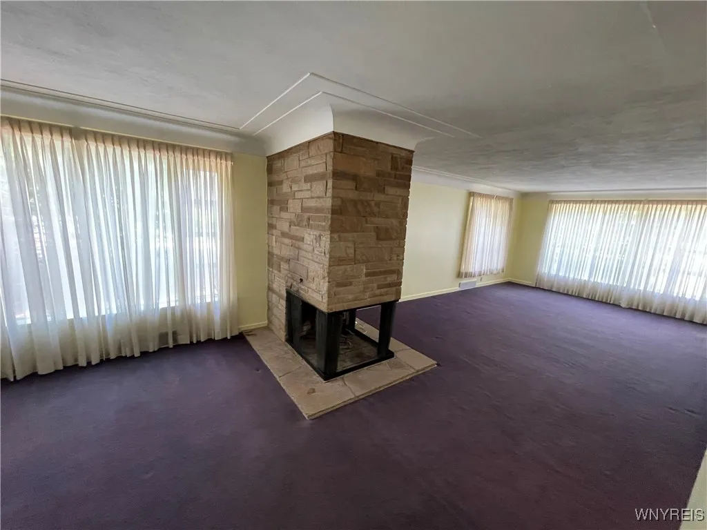 Living / dining Room Combo w/3 sided fireplace and large windows Living / dining Room Combo w/3 sided fireplace and large windows