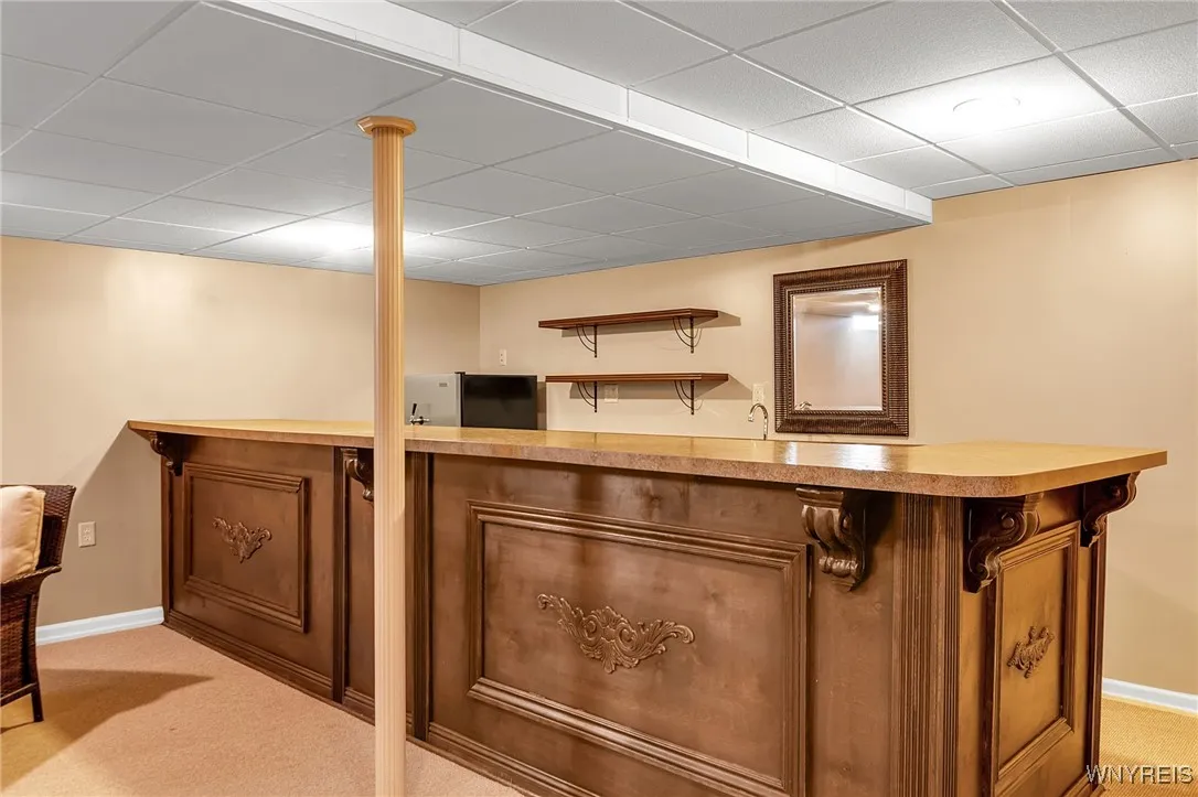 Basement bar with Bar with frigerator and dishwasher