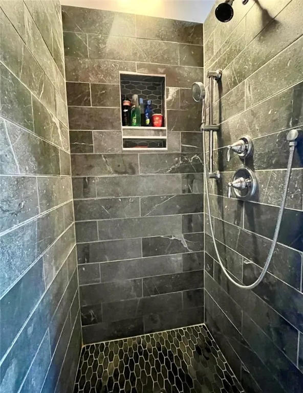 Custom tiled shower in primary bathroom