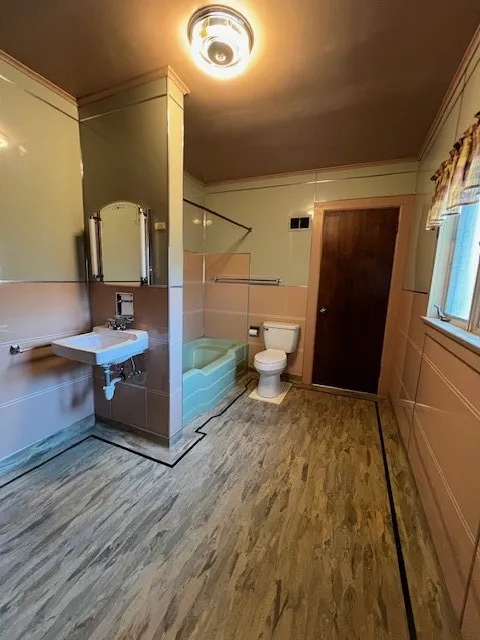 upstairs bathroom with art deco flooring; access from hallway or bedroom #3