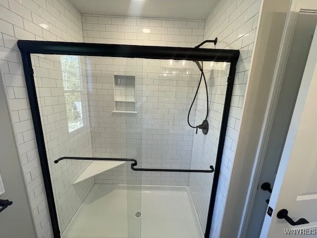 Ceramic tile shower in the primary bath