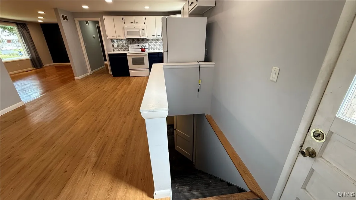 Kitchen / Dining Area, Stairs to the basement on the right