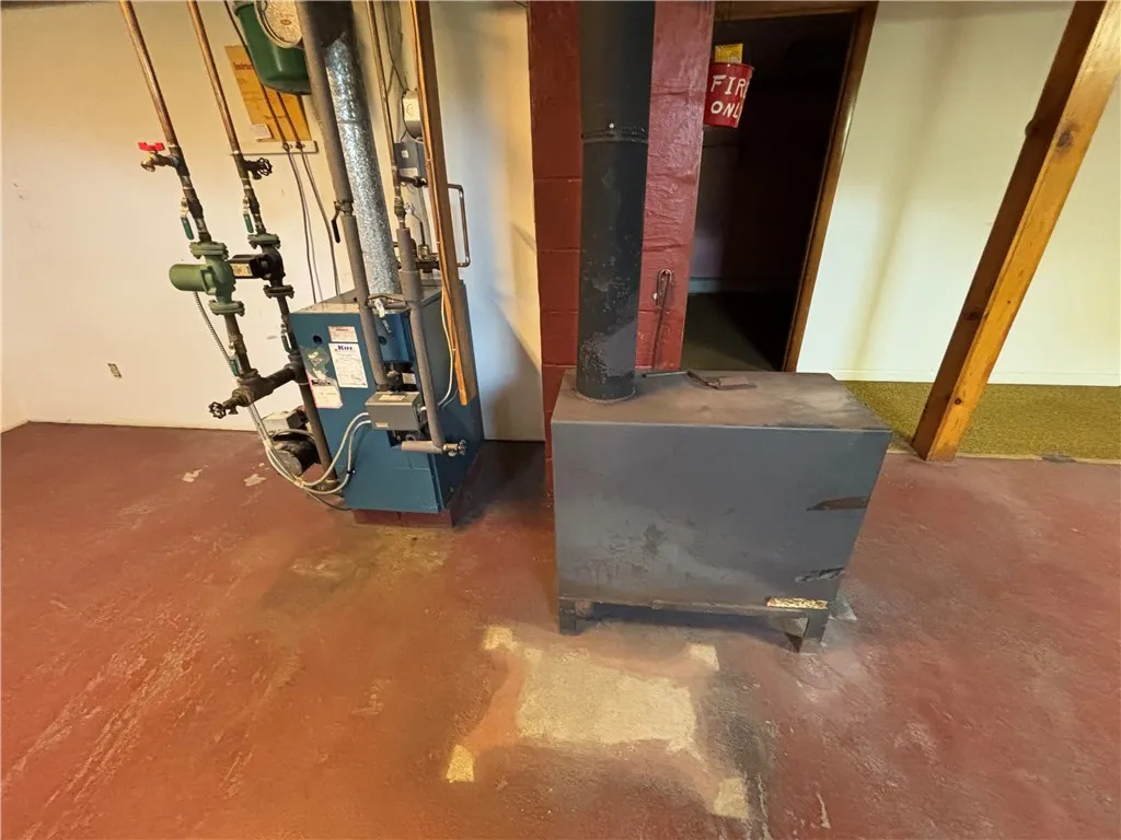 Oil Hot Water Baseboard and wood stove
