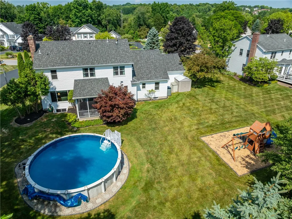 Flat Backyard with Heated Pool, Playset, Shed and Mature Trees