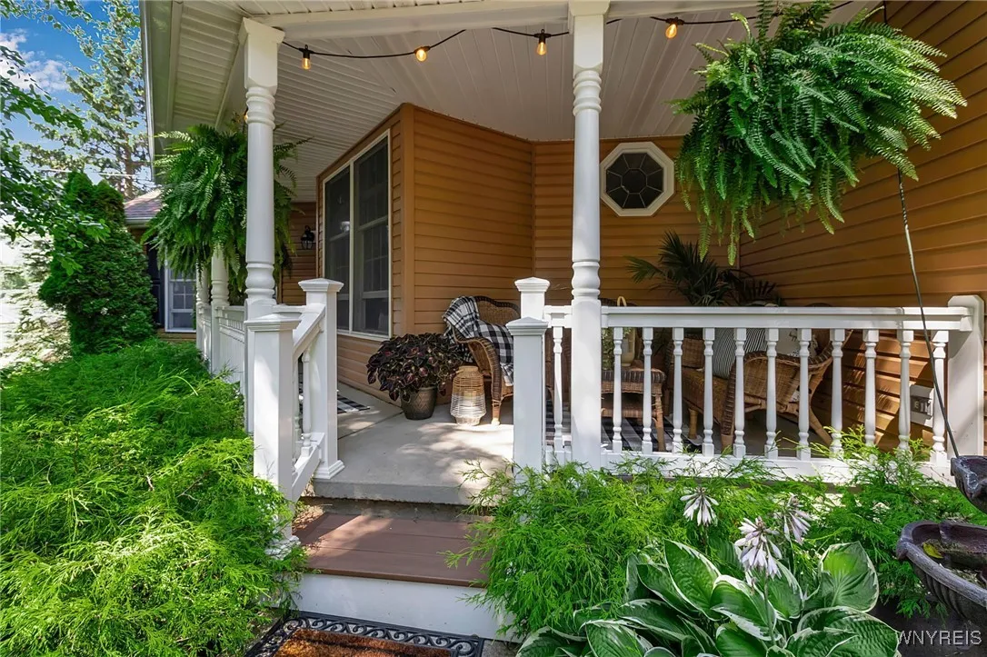 Covered front porch, vinyl wrapped railing