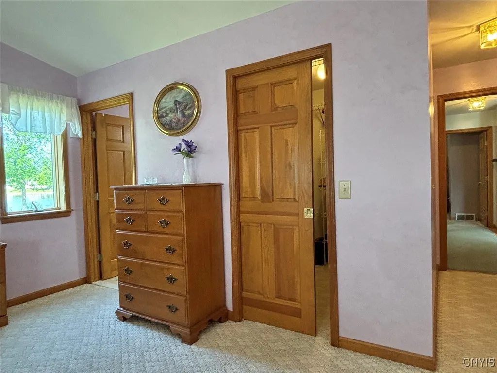 Primary bedroom.  Walk in closet has a pocket door.