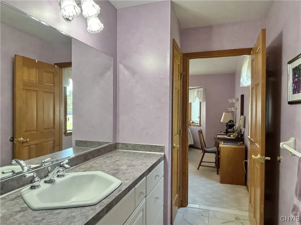 Primary bath.  Linen closet is on the left.