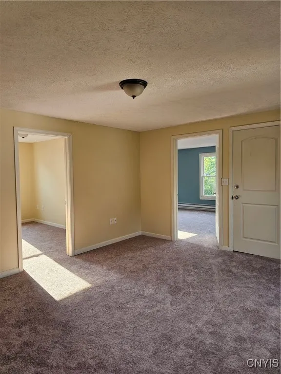 Living room area looking into bedrooms.