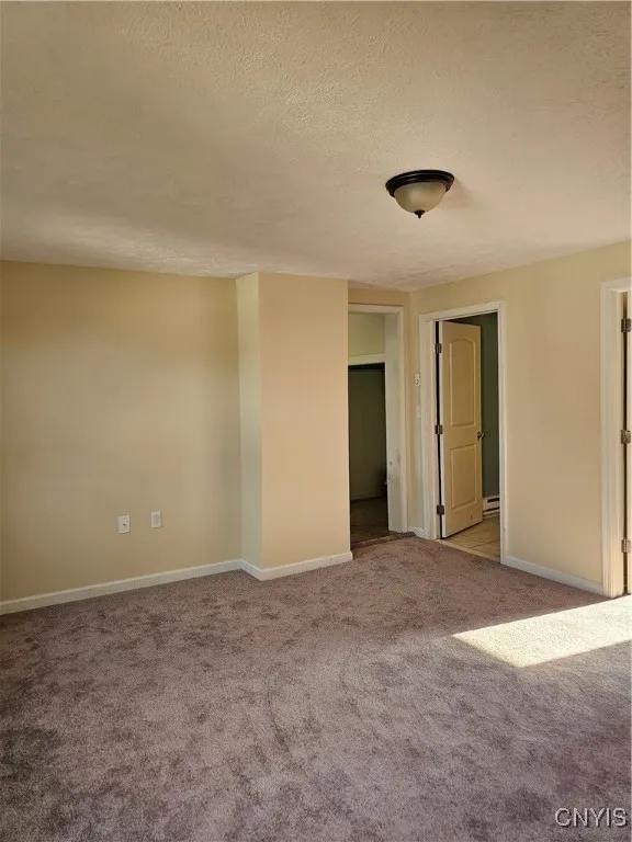 Living room area with new carpeting, freshly painted. Good size room!