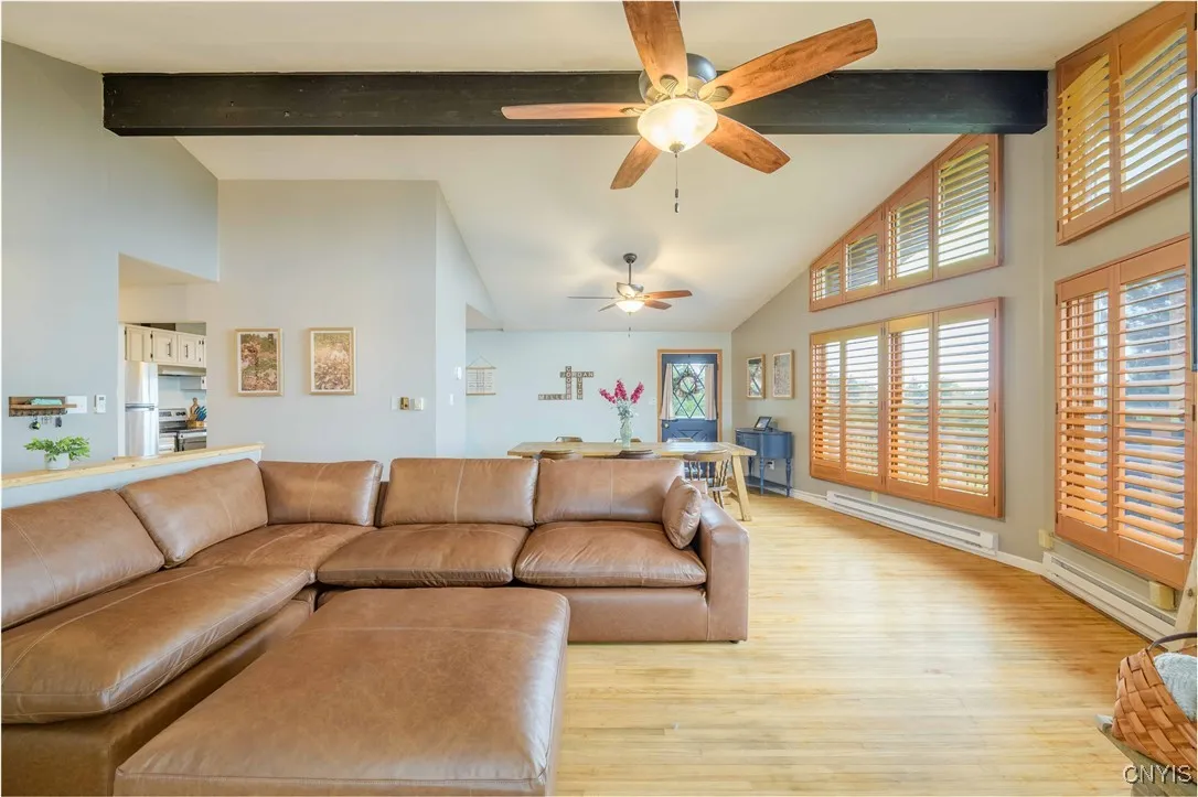 Living room, Dining room and a sneak peek into the Kitchen.