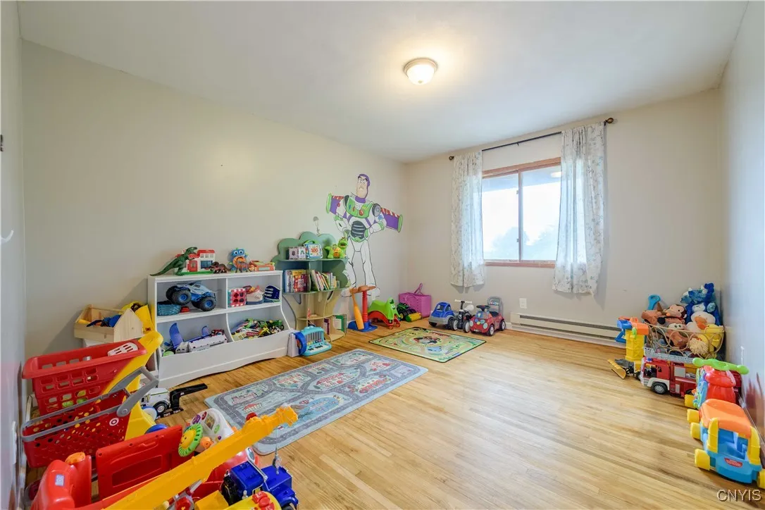 Bedroom #1 is spacious and currently being used as a play area.