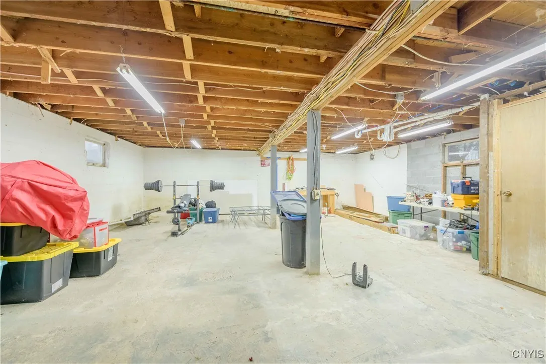 Basement on the lower level with extra usable space for working out, a work shop or storage.