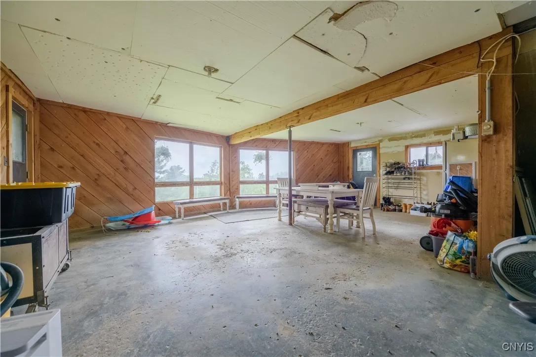 The basement with large windows on front of house and access to the outside.
