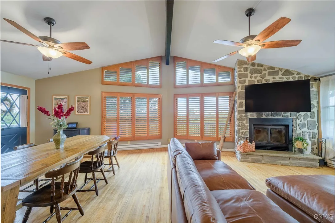 An open floor plan makes this space feel spacious and inviting. Access to the upper decks and the side yard from the dining room makes navigating this property convenient!