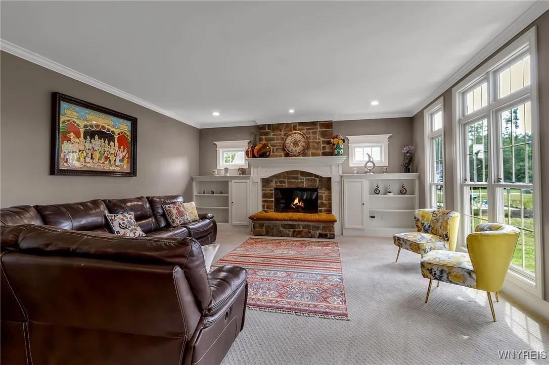 Dynamite Great Room with another fireplace and custom built-ins.