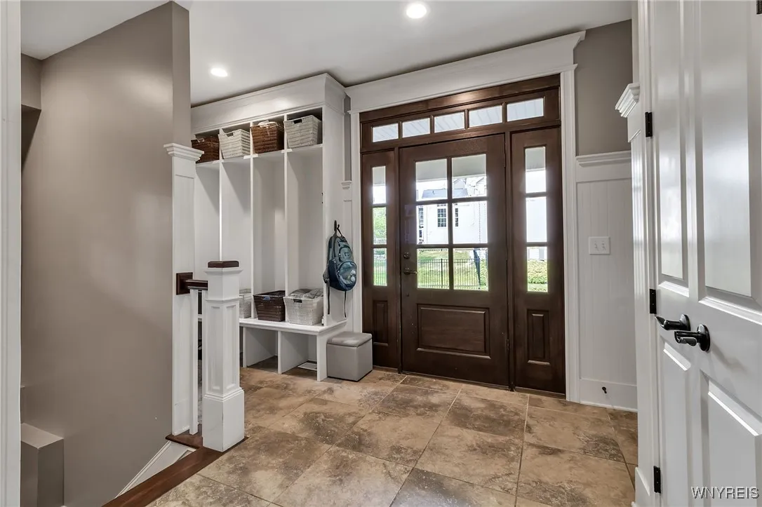 Mud Room with built in cubbies is off the side entrance and garage.