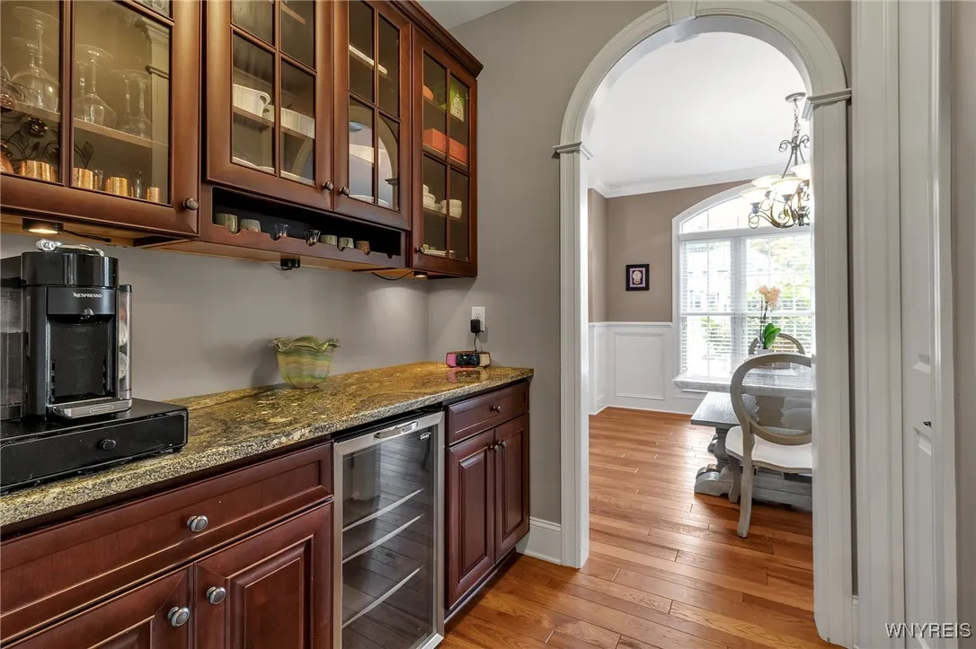 Awesome Butler's Pantry with granite and wine chiller.