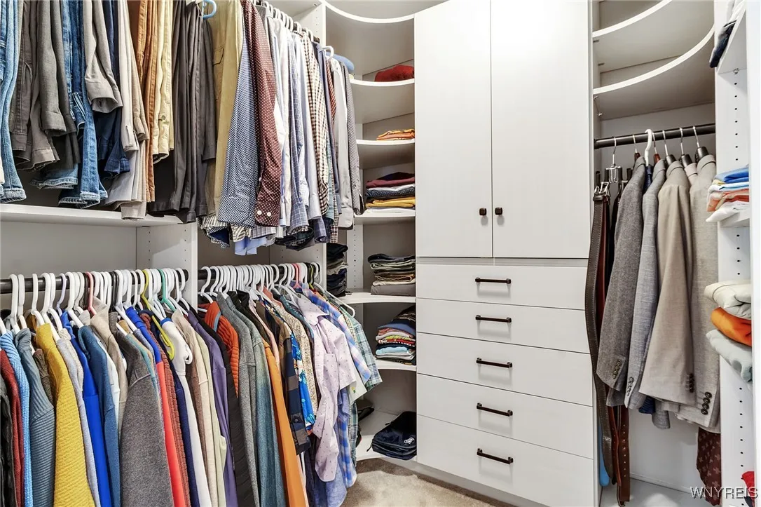 There are 2 walk in closets in this primary bedroom and all bedrooms have Custom Closet Systems.