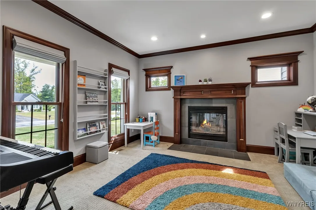 To the left of the foyer, use as a Den, Music Room, Playroom or Sitting Room/LR.  1st of 3 fireplaces!