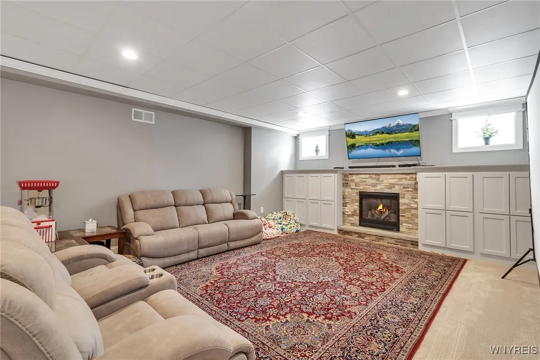 Absolutely awesome finished basement with 3rd fireplace and built in cabinetry.