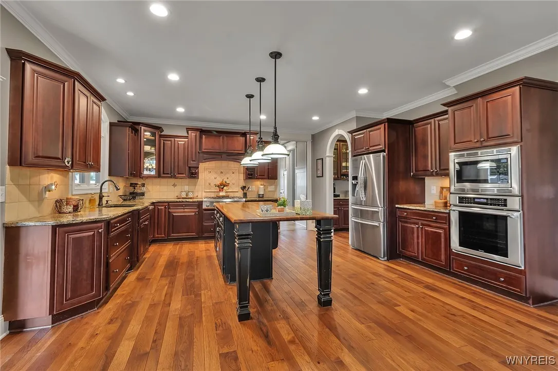 Now that's a KITCHEN!  Stunning cherry cabinetry, granite, stainless appliances, 6 burner gas stove & huge island!