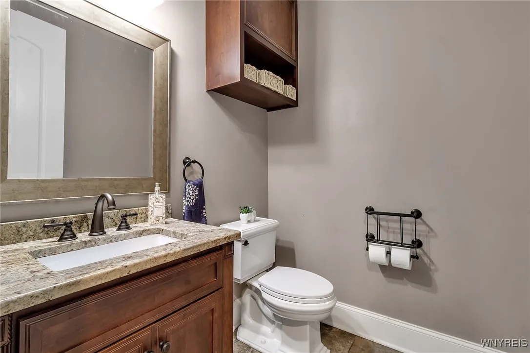 1st floor half Bath with granite counterop.
