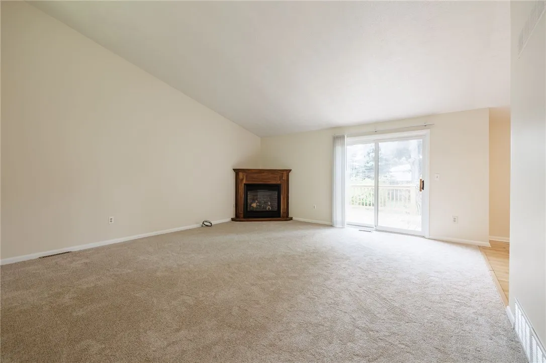 Living Room, Gas Fireplace and Sliding Door to the Deck