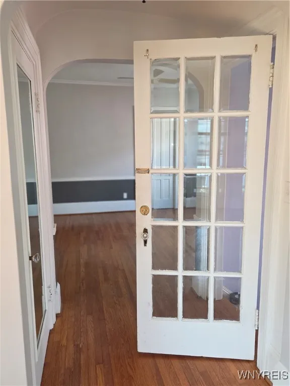 Upper - Entry way from stairs into dining room / living room