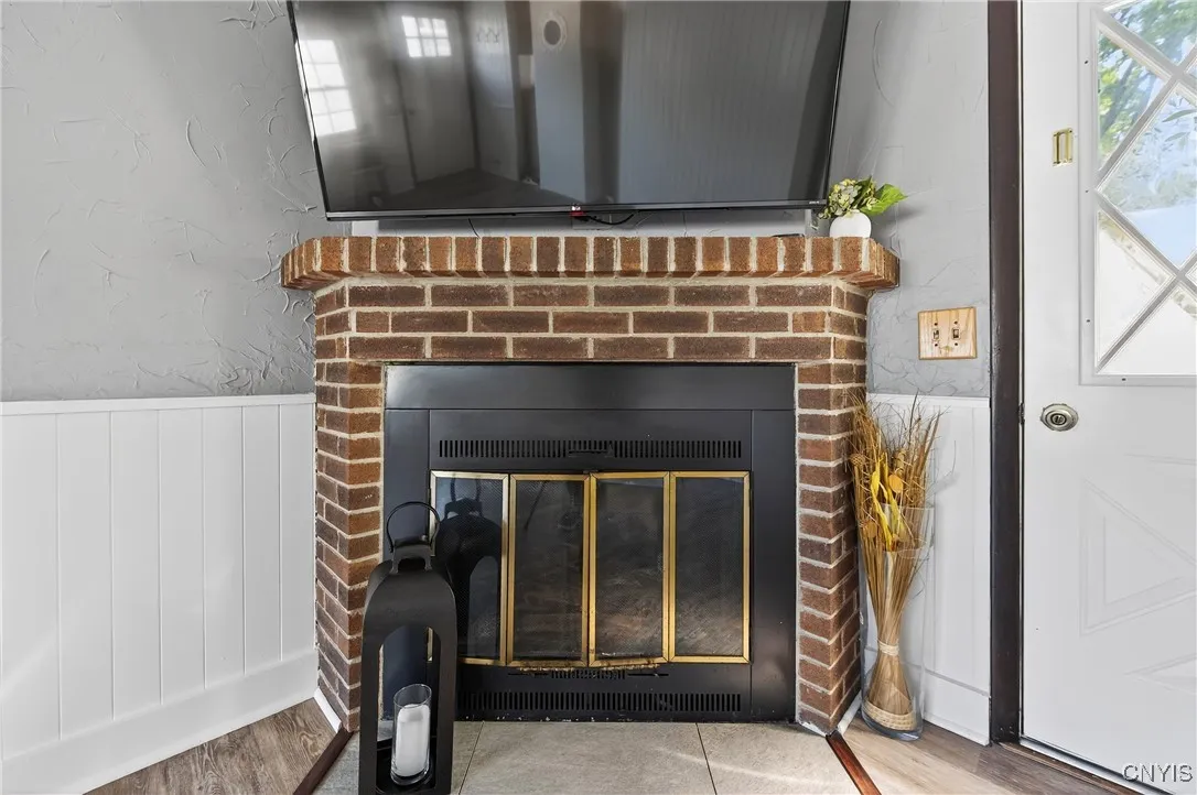 This wood burning fireplace has a blower keeping it nice and cozy warm all winter long.
