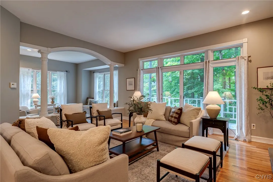 Stunning archway is encompassed with custom trim work