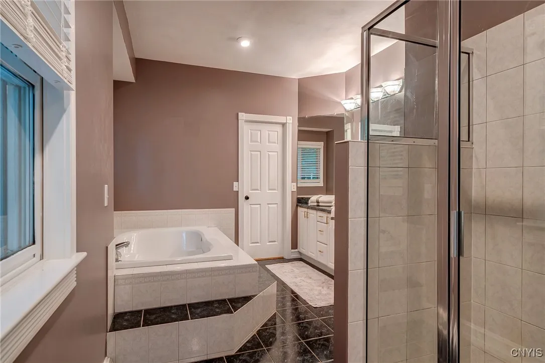 Primary Bathroom with generous Walk in Closet , Jetted Tub, Double Sinks amd Walk in Shower