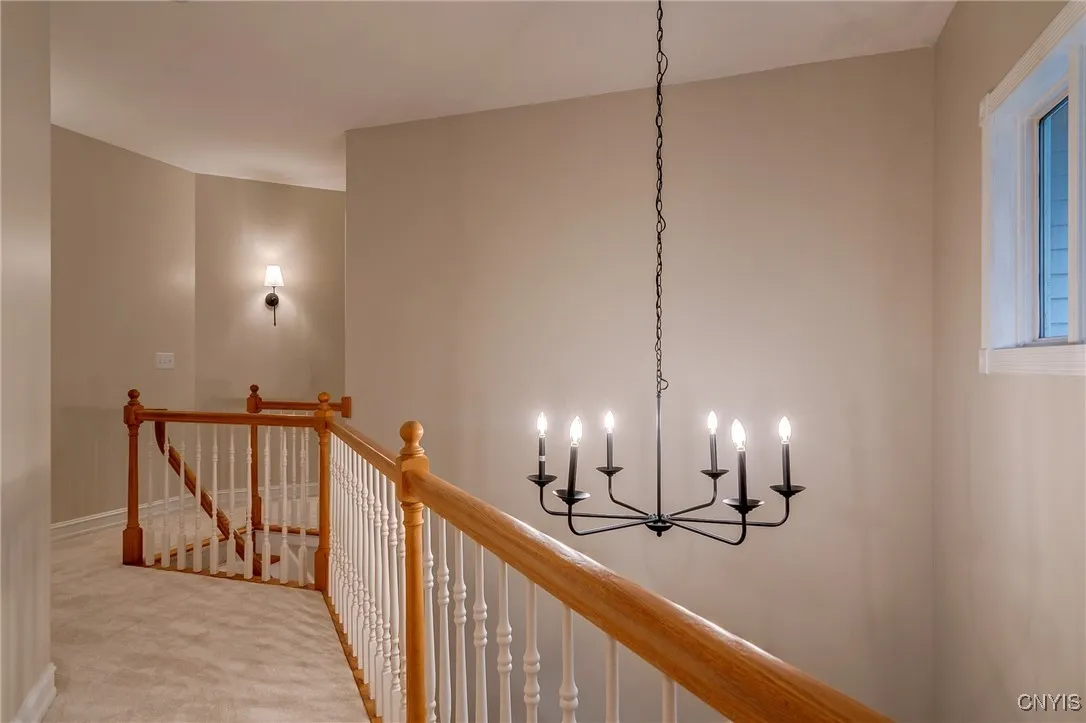 The upstairs hallway is so open and airy