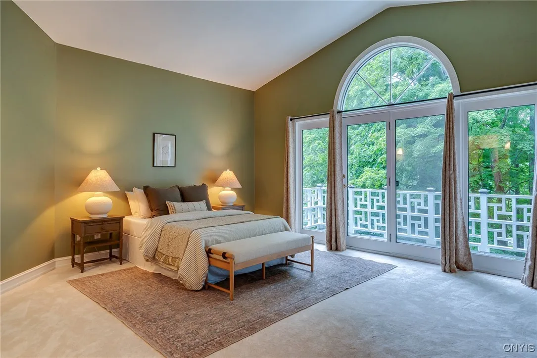 Impressive Primary Suite with Cathedral Ceilings, Balcony and Fireplace