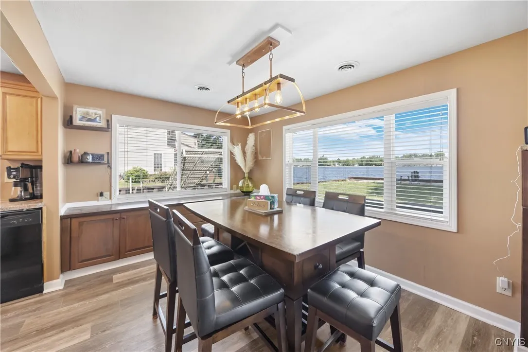 Another view of the Dining Area with water views and lots of natural light coming in from both sides.  The built-in Buffet also features extra storage cabinetry.