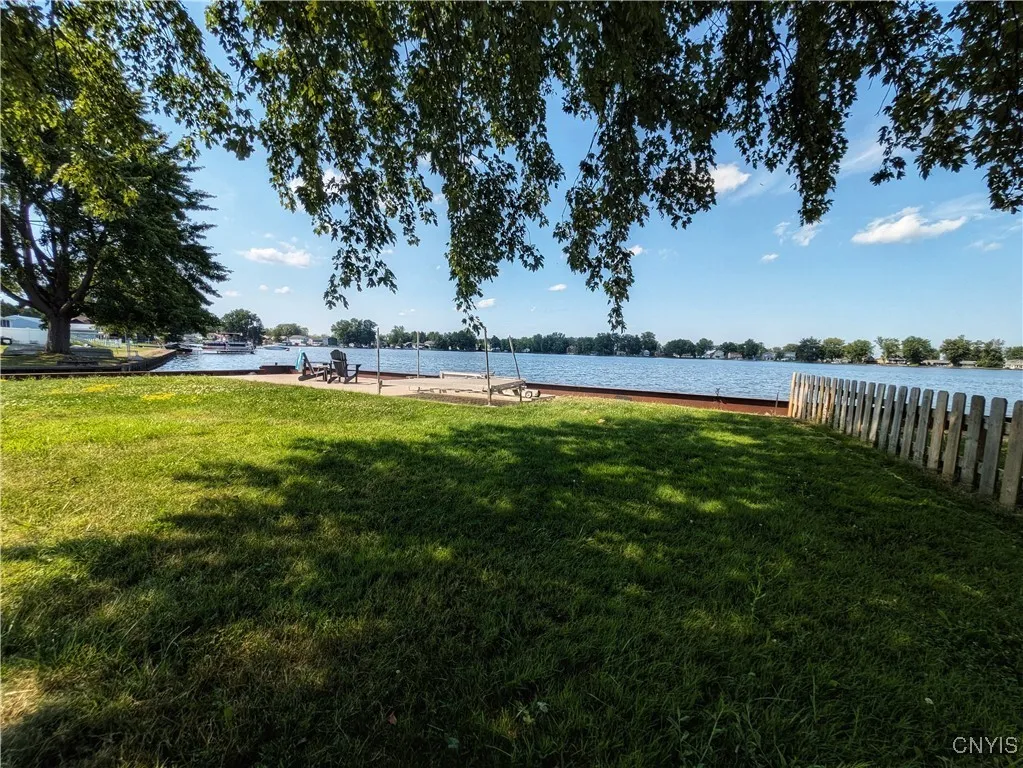 The view of the lake from the shady side yard.  Plenty of space for all kinds of Summertime fun & games!