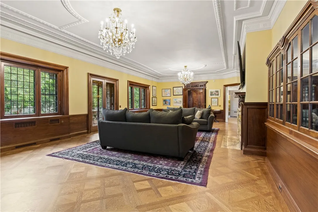 Off of the foyer, is the grand ballroom which also can double as a masterful living room.