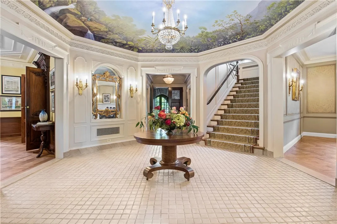 The spectacular octagonal foyer adorned with Rick Muto’s four-season ceiling mural, welcomes visitors with historical grandeur.