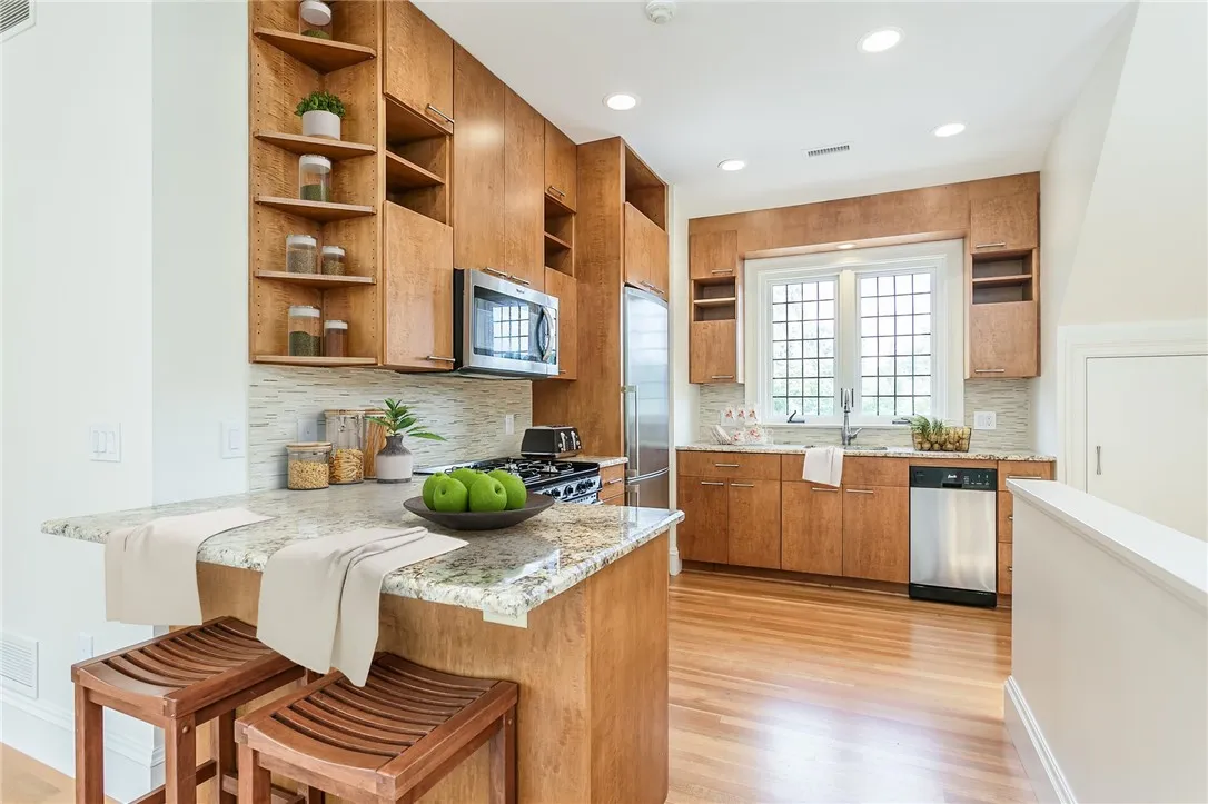 The contemporary kitchen of the carriage house is part of the open floor plan.