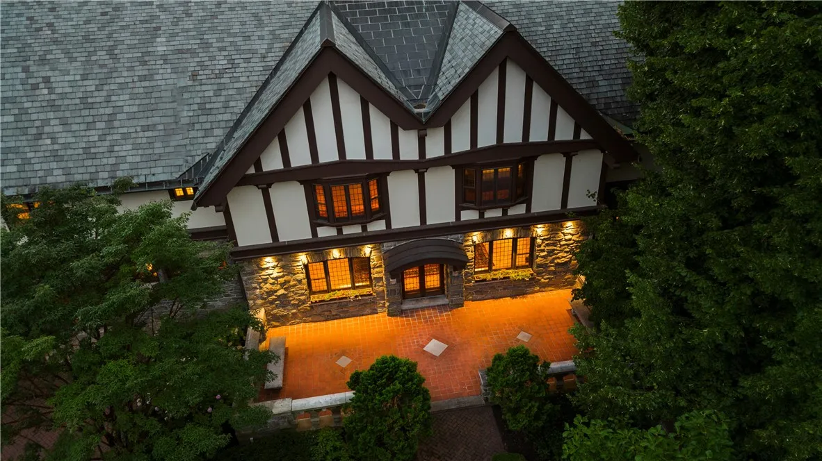 This palatial estate offers unparalleled privacy and sophistication tucked in the heart of Rochester, New York.

