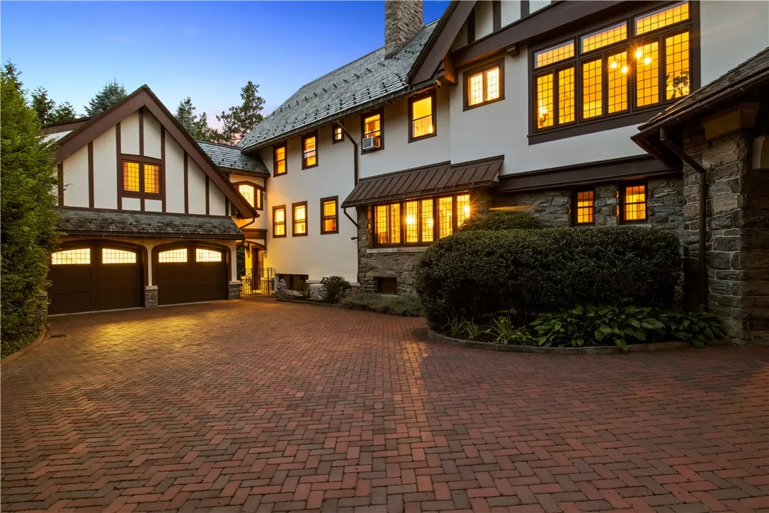 Adjoining carriage house features apartment with private entrance.