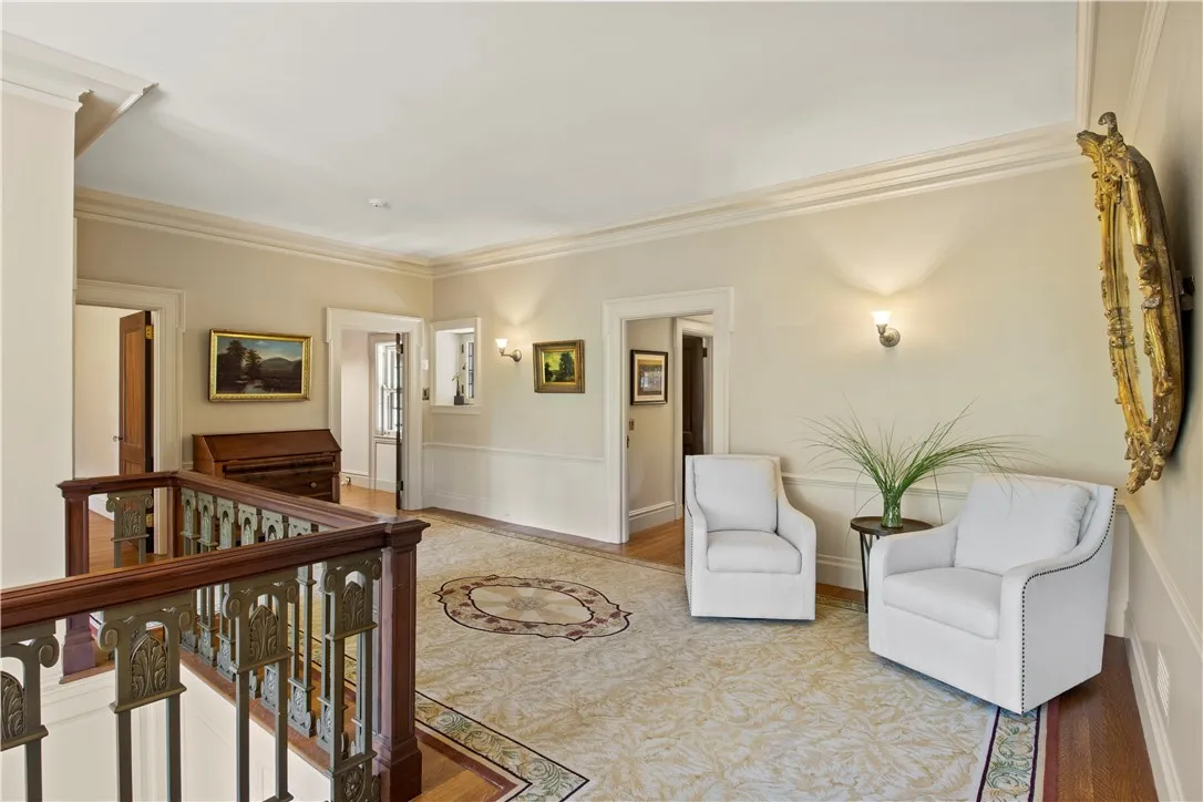 At the top of the staircase, beautiful landing and sitting area greets you.
